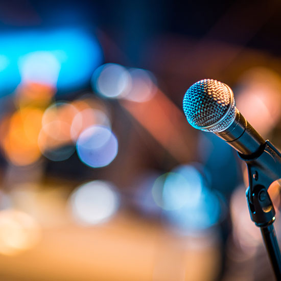 2026 Pub. 14 Issue 2 7 Microphone at convention